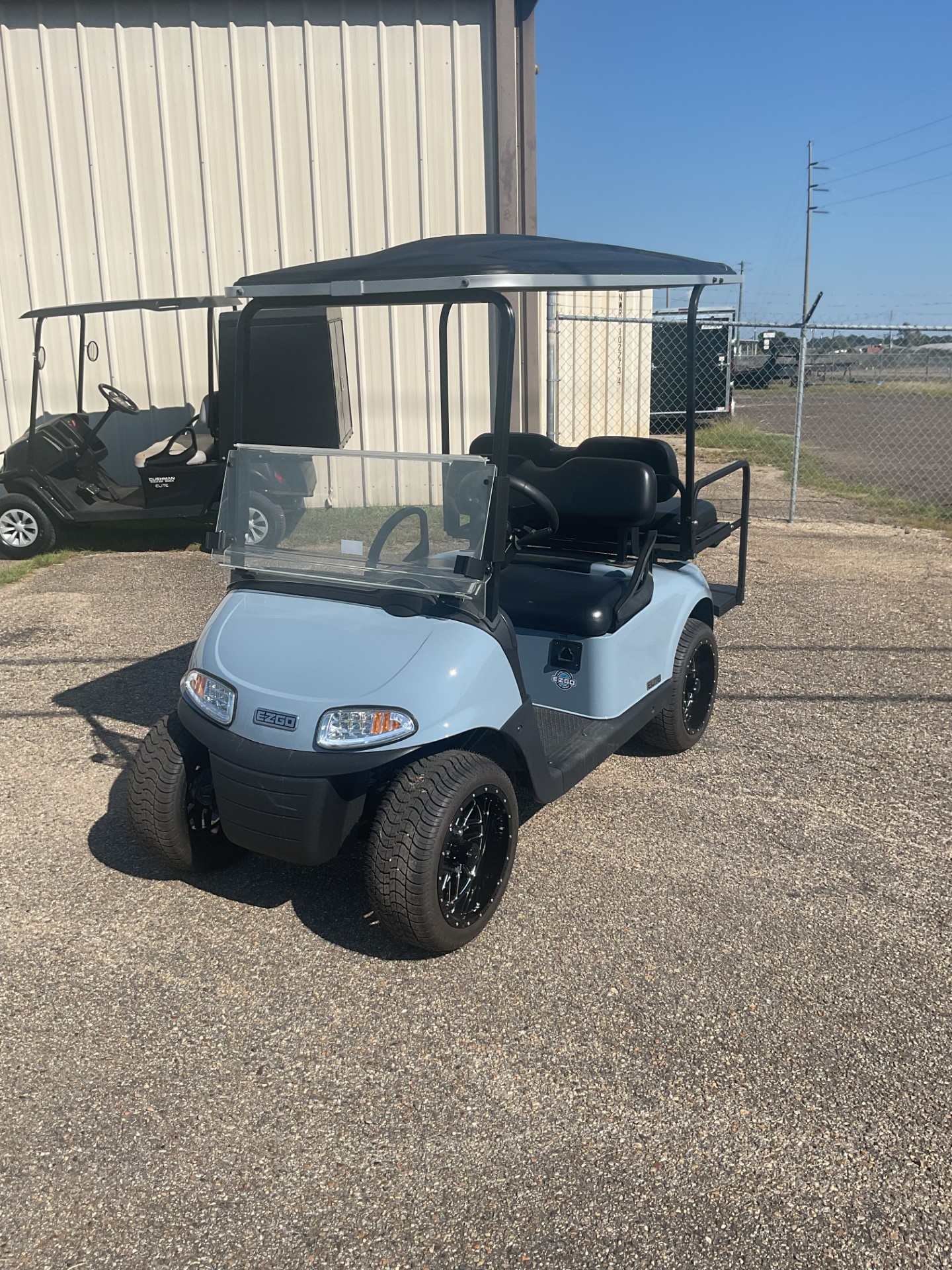 Used 2021 E-Z-GO RXV golf cart in light blue