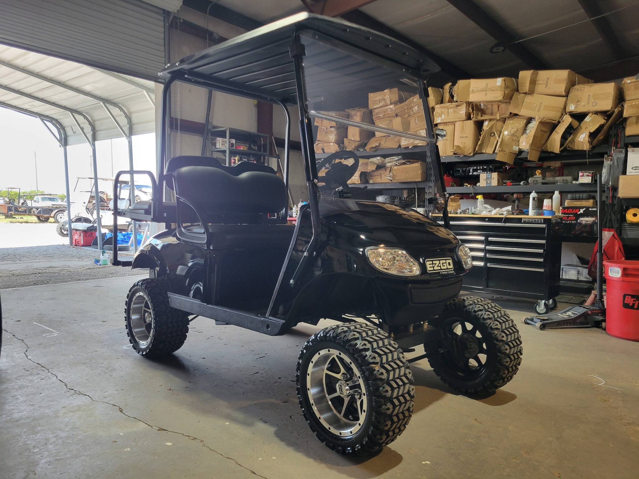 Custom black lifted E-Z-GO golf cart